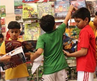 Students browsing books at the school book fair